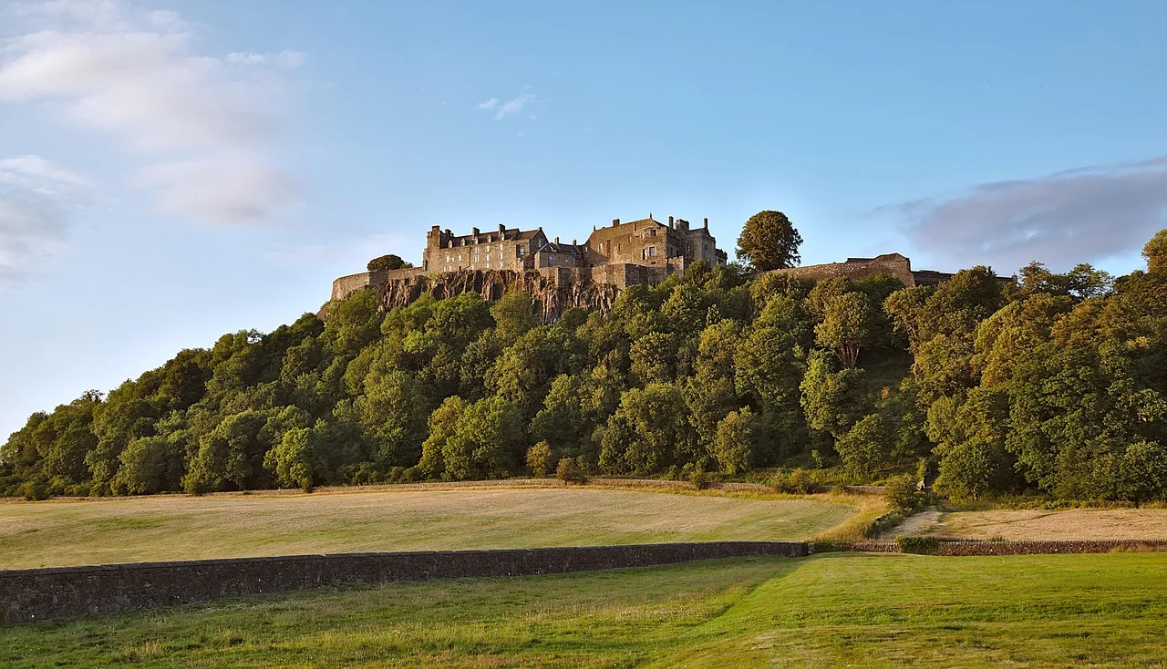 Stirling Castle at the top of the hill surrounded by trees