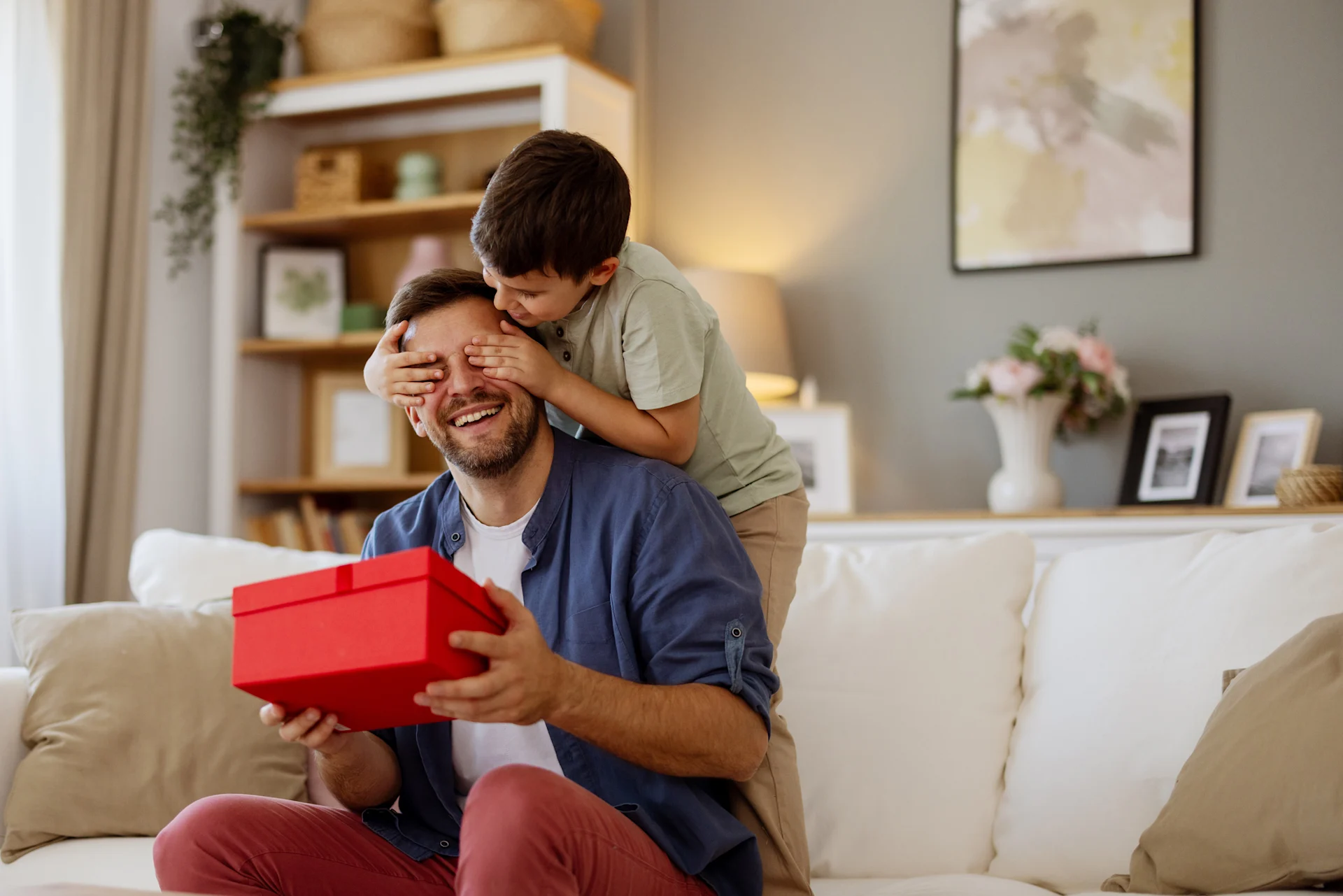 father and son opening father's day gift
