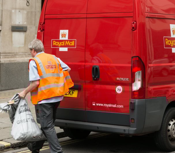 Royal Mail driver outside his van
