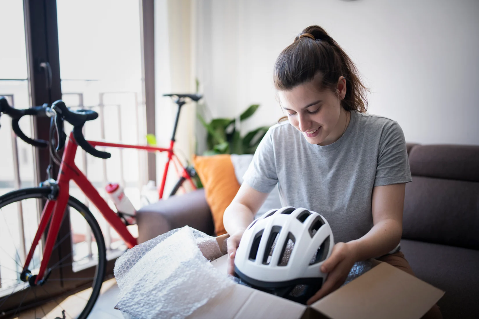 Woman opening a bike from box