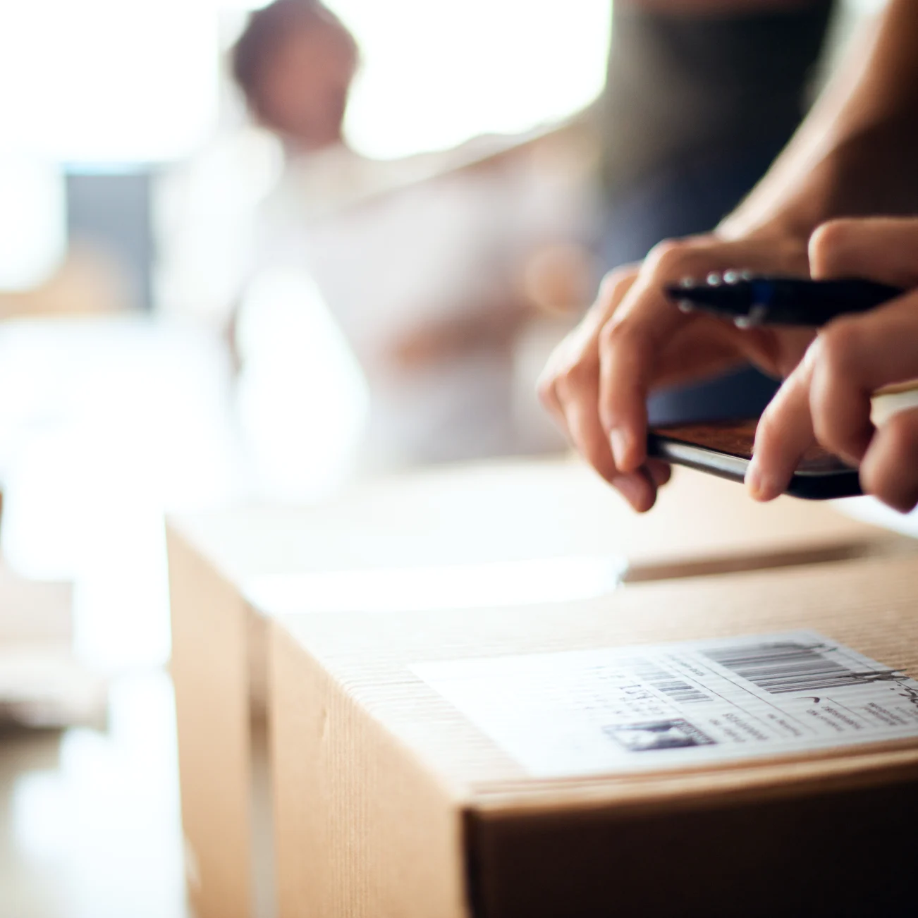 Person taking photo of parcel label