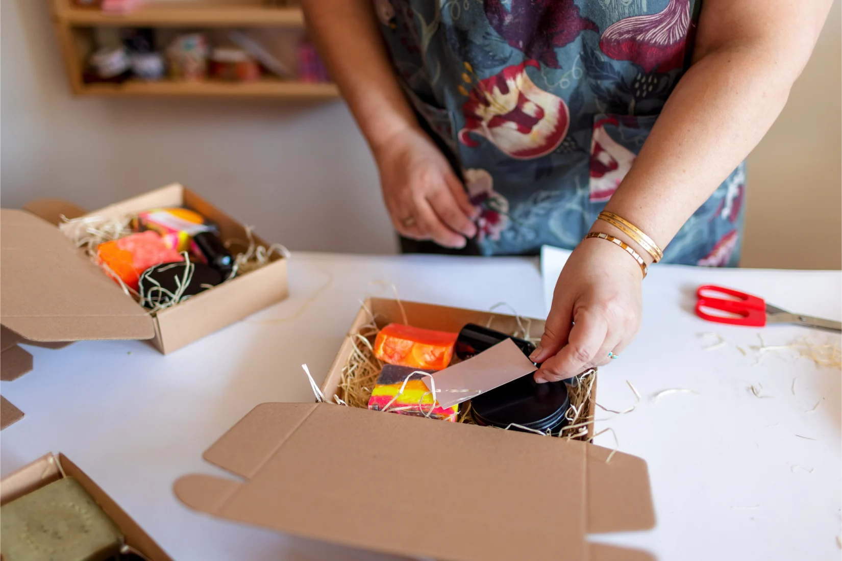 Person packing a folksy parcel